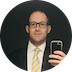 Paul E. Yeager in a suit and Thai yellow neck tie